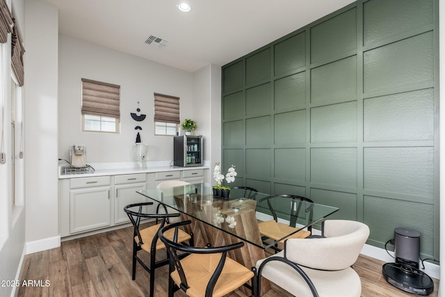 6621 S Balboa Dr, Gilbert, AZ 85298 - dining room with a decorative wall, dark wood-type flooring, baseboards, and recessed lighting