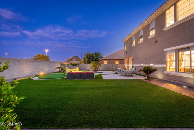 6621 S Balboa Dr, Gilbert, AZ 85298 - yard at dusk featuring a patio area and outdoor lounge area