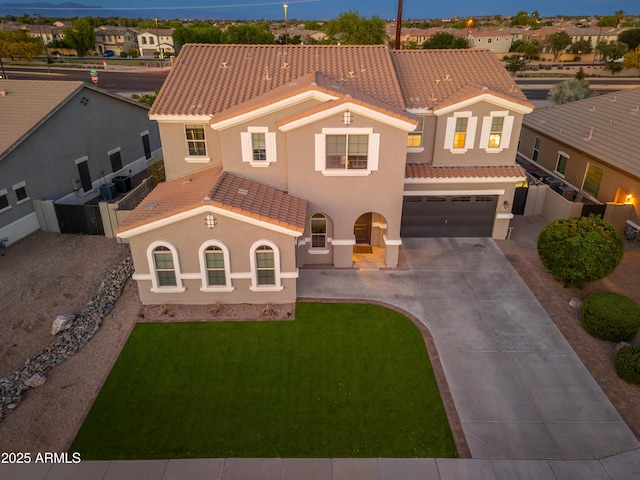 6621 S Balboa Dr, Gilbert, AZ 85298 - mediterranean / spanish house with a tile roof, stucco siding, driveway, an attached garage, and a residential view