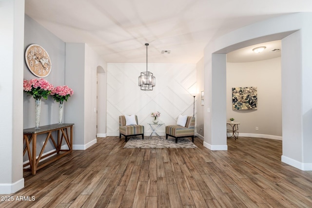 6621 S Balboa Dr, Gilbert, AZ 85298 - living area with arched walkways, wood finished floors, and baseboards