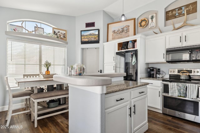 13320 N 82nd Dr, Peoria, AZ 85381 - kitchen with black microwave, double oven range, white cabinetry, dark wood-type flooring, and open shelves