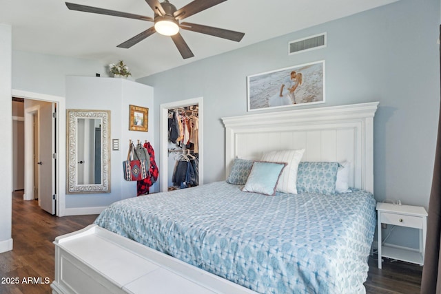 13320 N 82nd Dr, Peoria, AZ 85381 - bedroom with dark wood-style floors, a spacious closet, baseboards, and a closet