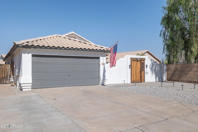 13320 N 82nd Dr, Peoria, AZ 85381 - view of front of property with concrete driveway, fence, a tiled roof, and stucco siding