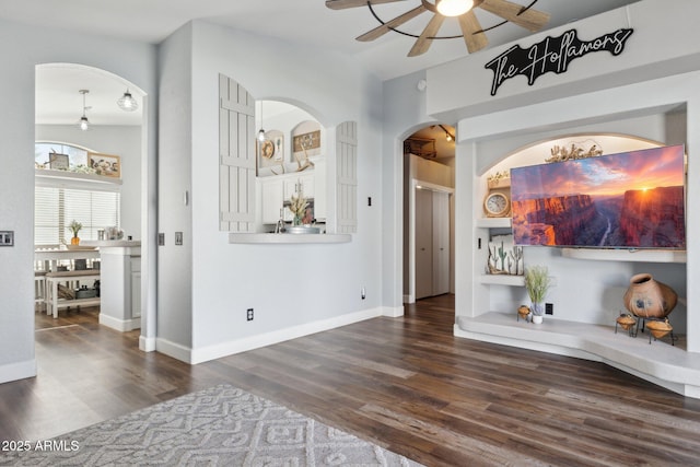 13320 N 82nd Dr, Peoria, AZ 85381 - interior space featuring arched walkways, dark wood finished floors, and baseboards