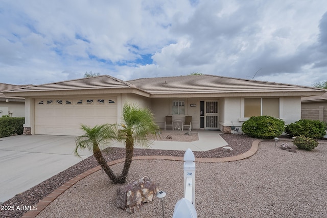 ranch-style house featuring covered porch, stucco siding, driveway, and a garage