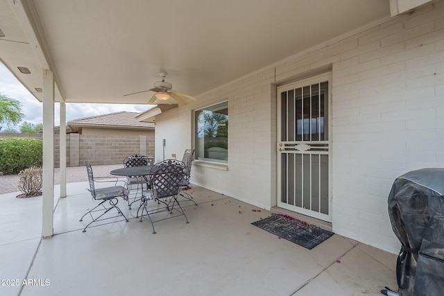 view of patio / terrace with a ceiling fan, outdoor dining area, area for grilling, and fence