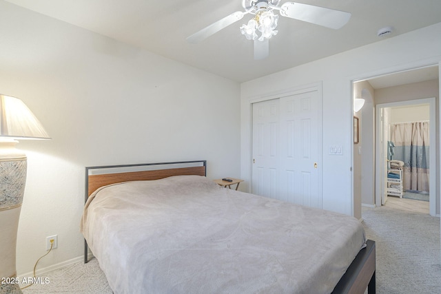 carpeted bedroom with baseboards, a closet, and a ceiling fan