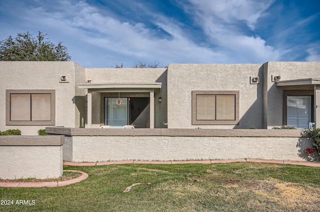 view of side of property with a lawn