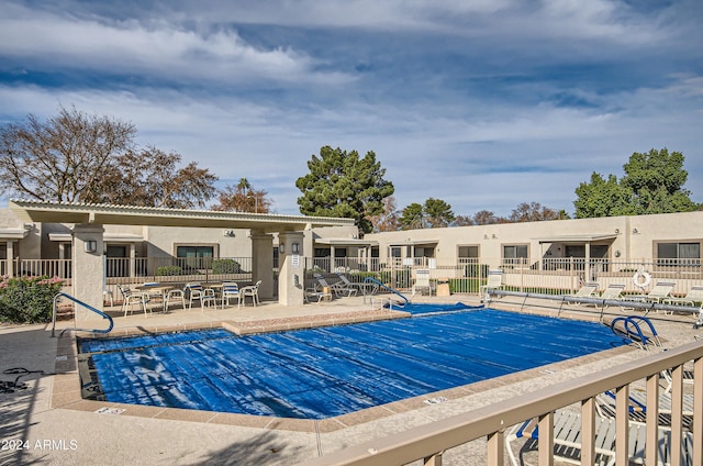 view of swimming pool featuring a patio area