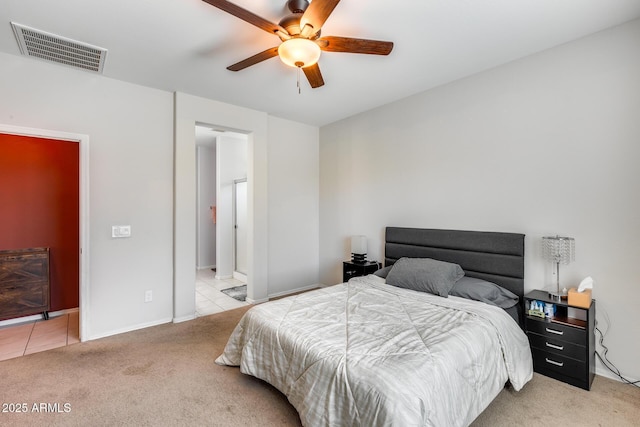 bedroom featuring light carpet and ceiling fan