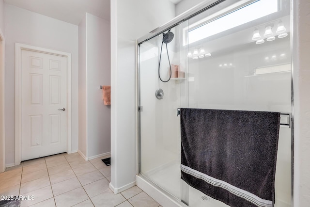 bathroom with tile patterned floors and an enclosed shower