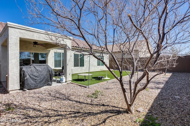 exterior space with a patio and ceiling fan