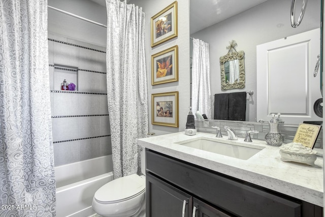 bathroom with shower / bath combination with curtain, vanity, and toilet