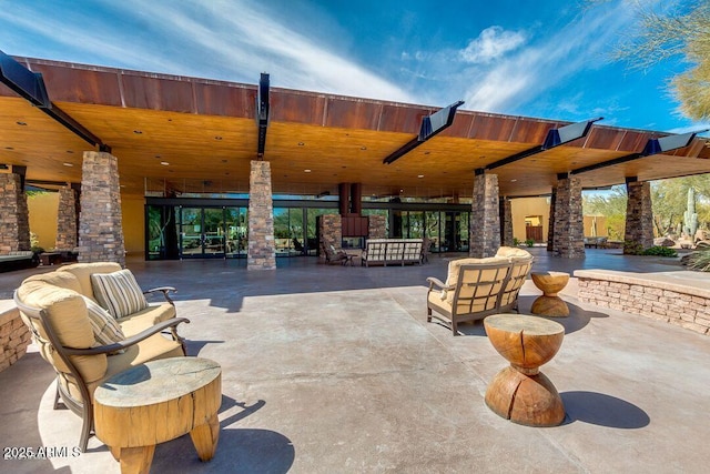 view of patio / terrace featuring ceiling fan and an outdoor living space