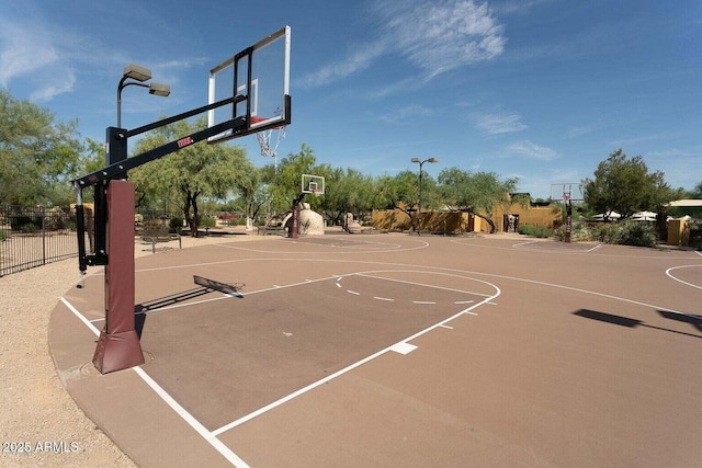 view of sport court with community basketball court and fence