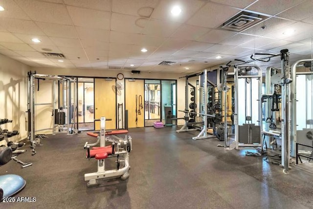 gym featuring a paneled ceiling, visible vents, and recessed lighting