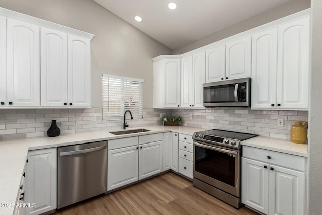 1114 N Leland Ct, Gilbert, AZ 85233 - kitchen featuring stainless steel appliances, a sink, decorative backsplash, and recessed lighting
