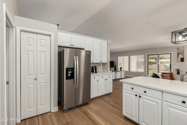 1114 N Leland Ct, Gilbert, AZ 85233 - kitchen with stainless steel fridge, light wood finished floors, white cabinetry, and light countertops