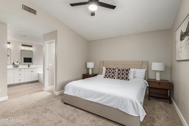 1114 N Leland Ct, Gilbert, AZ 85233 - bedroom featuring light carpet, ensuite bathroom, baseboards, vaulted ceiling, and a ceiling fan