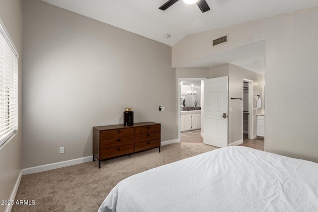 1114 N Leland Ct, Gilbert, AZ 85233 - bedroom with light carpet, ensuite bathroom, baseboards, lofted ceiling, and a ceiling fan