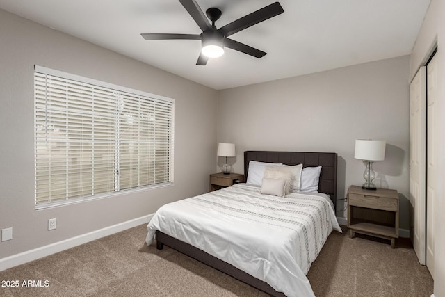 1114 N Leland Ct, Gilbert, AZ 85233 - bedroom with carpet flooring, baseboards, a closet, and ceiling fan