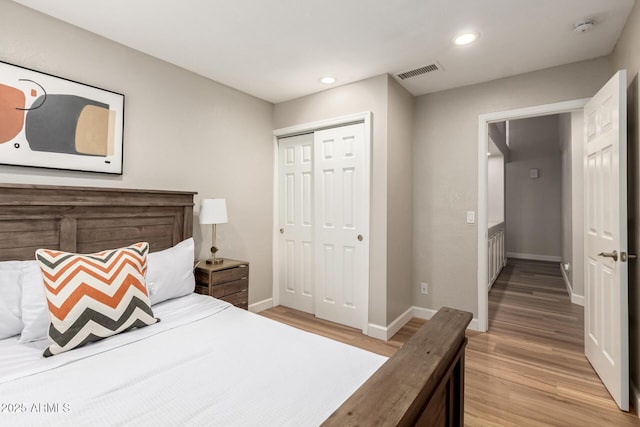 1114 N Leland Ct, Gilbert, AZ 85233 - bedroom with light wood-style flooring, baseboards, a closet, and recessed lighting