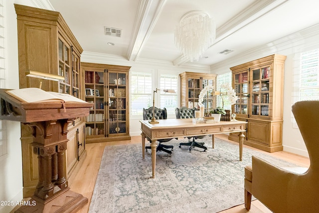 office featuring ornamental molding, light wood-style flooring, plenty of natural light, and beamed ceiling
