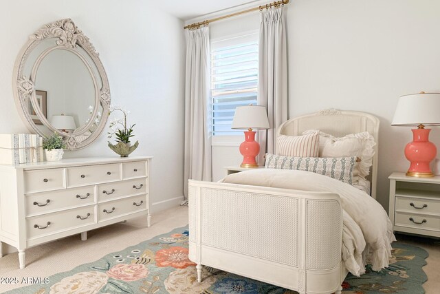 bedroom with carpet and baseboards