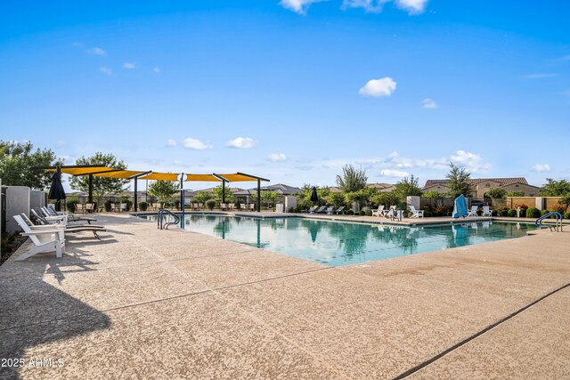 community pool featuring a patio area