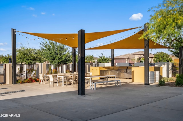 view of patio featuring fence