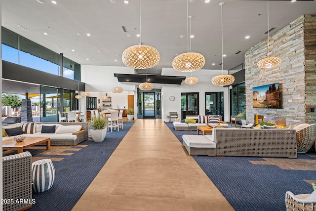 building lobby featuring a high ceiling and recessed lighting