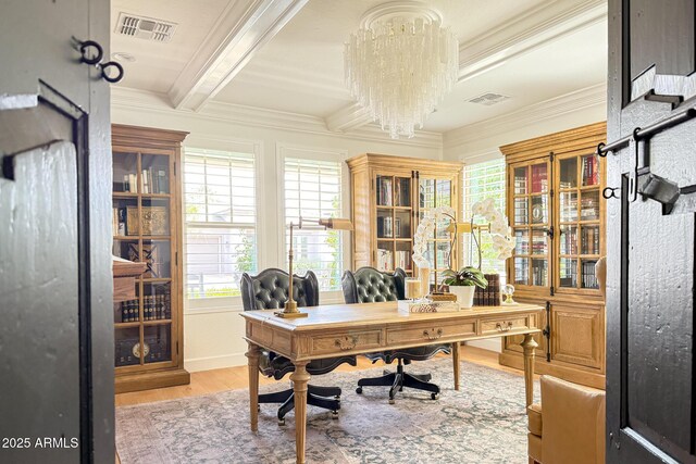 office space featuring crown molding, light wood-type flooring, a chandelier, and beam ceiling