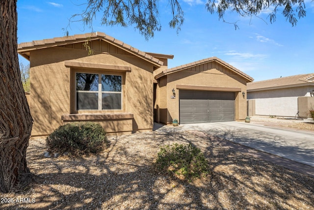 ranch-style home featuring stucco siding, driveway, and a garage