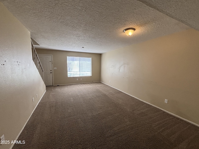 7126 N 19th Ave Unit 108, Phoenix, AZ 85021 - spare room with carpet flooring, baseboards, and a textured ceiling
