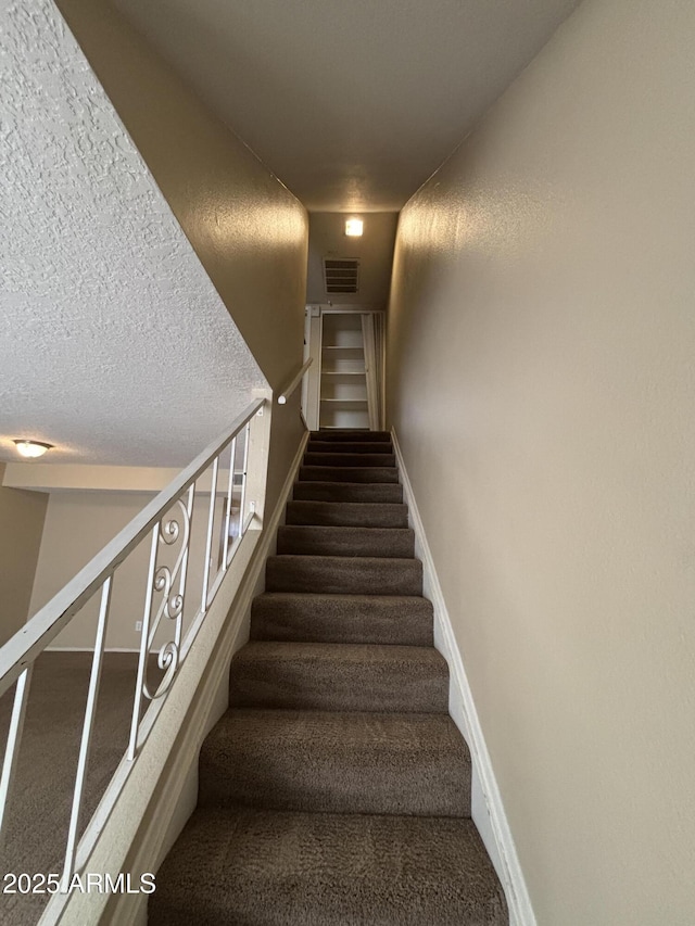 7126 N 19th Ave Unit 108, Phoenix, AZ 85021 - stairs featuring baseboards and carpet flooring