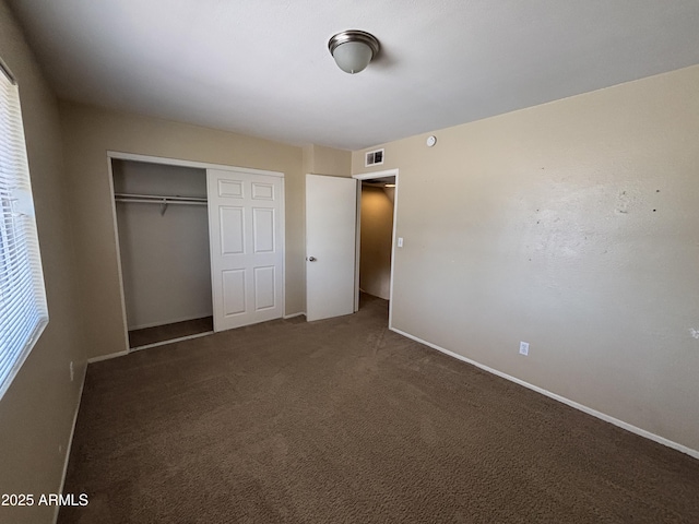 7126 N 19th Ave Unit 108, Phoenix, AZ 85021 - unfurnished bedroom with a closet, carpet floors, and baseboards