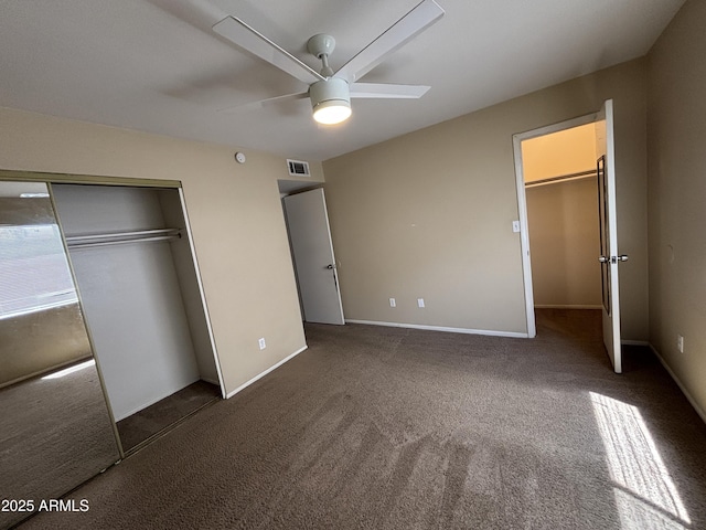7126 N 19th Ave Unit 108, Phoenix, AZ 85021 - unfurnished bedroom featuring a closet, carpet floors, a ceiling fan, and baseboards