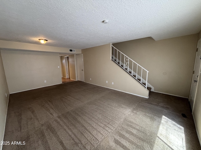 7126 N 19th Ave Unit 108, Phoenix, AZ 85021 - unfurnished living room featuring stairs, a textured ceiling, carpet, and baseboards