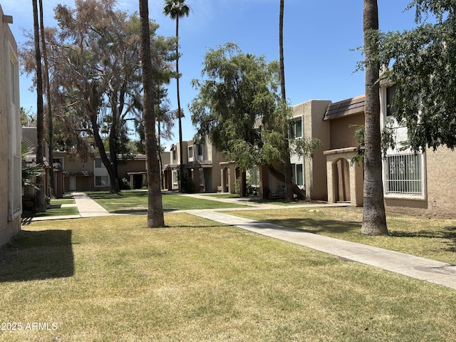 7126 N 19th Ave Unit 108, Phoenix, AZ 85021 - view of community with a lawn