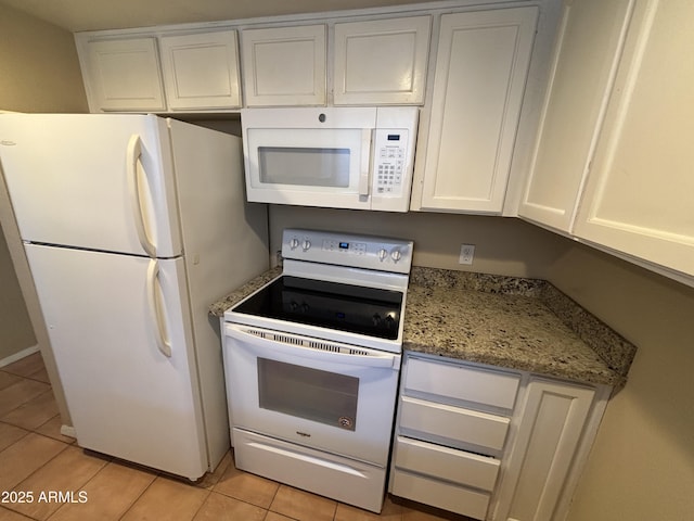 7126 N 19th Ave Unit 108, Phoenix, AZ 85021 - kitchen with white appliances, light tile patterned flooring, white cabinets, and light stone countertops