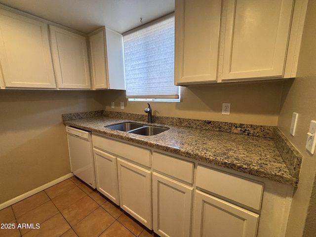 7126 N 19th Ave Unit 108, Phoenix, AZ 85021 - kitchen with dishwasher, a sink, white cabinets, light tile patterned floors, and baseboards