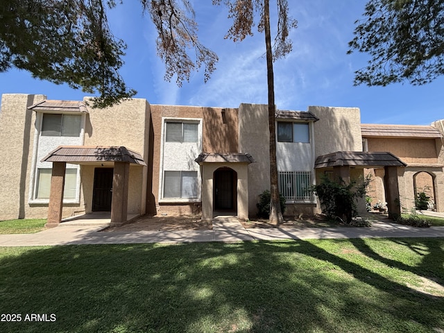7126 N 19th Ave Unit 108, Phoenix, AZ 85021 - view of front of property featuring a front lawn and stucco siding