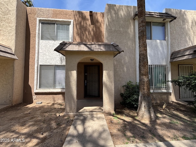 7126 N 19th Ave Unit 108, Phoenix, AZ 85021 - view of front of property with stucco siding, metal roof, and a standing seam roof