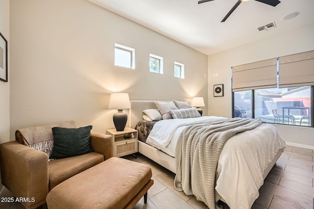 bedroom with a ceiling fan, visible vents, and baseboards