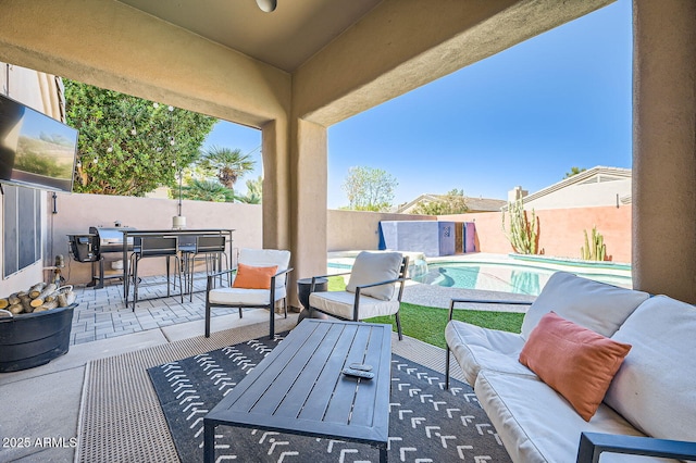 view of patio featuring an outdoor hangout area, outdoor dining area, a fenced backyard, and a fenced in pool