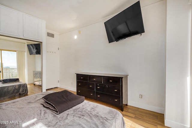 bedroom featuring light hardwood / wood-style floors