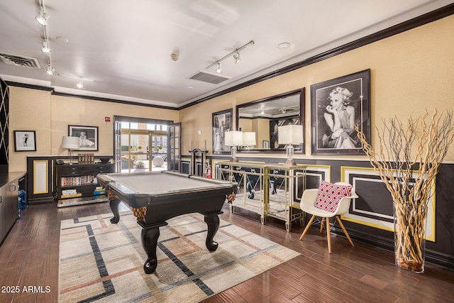 game room with ornamental molding, dark wood-type flooring, track lighting, and billiards