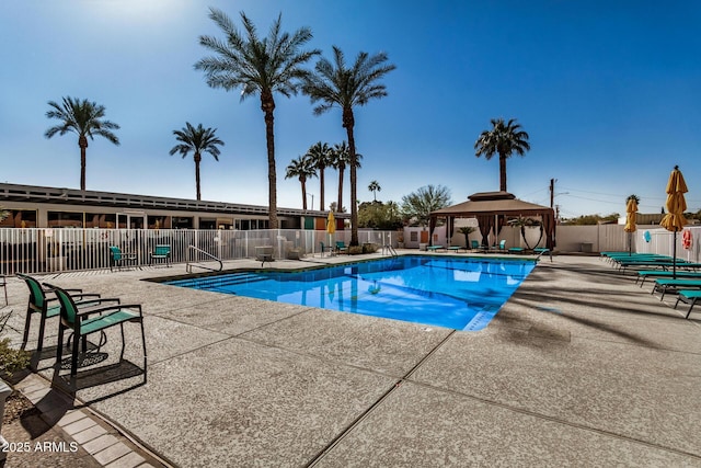 view of swimming pool featuring a gazebo and a patio area