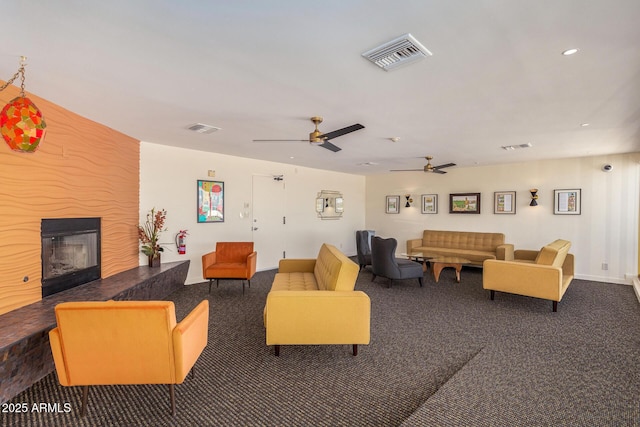 carpeted living room with ceiling fan