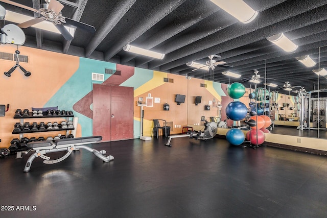 exercise room with ceiling fan